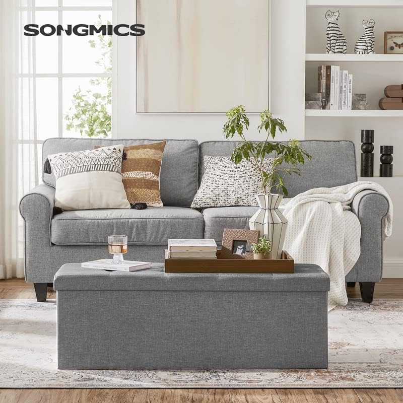 SONGMICS MAZIE Collection - 43 Inches Folding Storage Ottoman Bench, Ottoman Foot Rest, End of Bed Bench, Storage Chest, Load 660 lb, for Living Room, Bedroom, Entryway, Light Gray ULSF77G